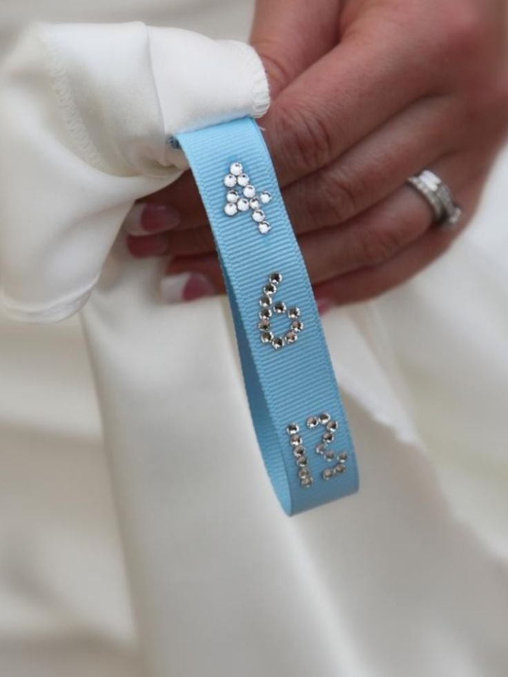 Totally doing this, I have never like the date sewn on the dress but I love this ribbon inside and maybe the date embroidered on that! MY SOMETHING BLUE!